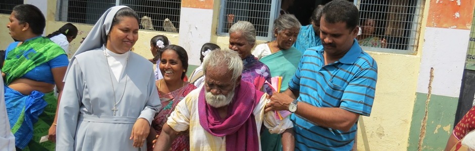 Sr. Sumi Joseph  Directress of FIDES assisting the old person for treatment  